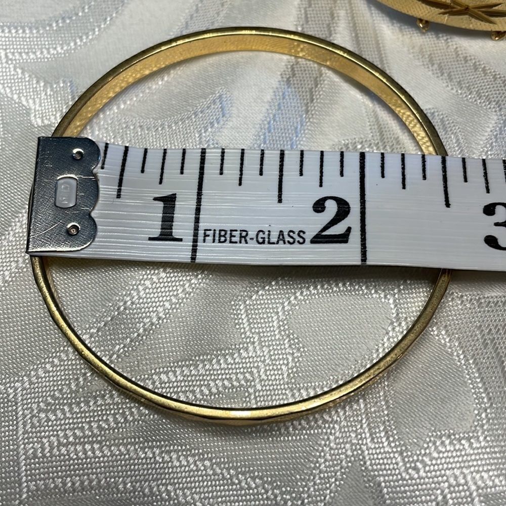Two gold tone bracelets: one is vintage hinged & other is Monet faceted bangle - Picture 9 of 13